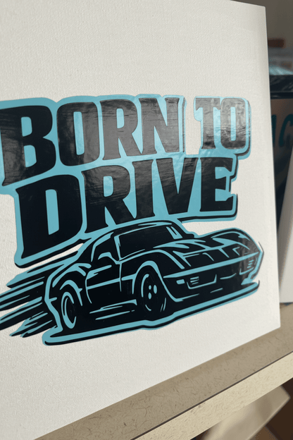 Born to Drive – Handmade muscle car canvas sign with sleek car graphic in teal and black on flat canvas.