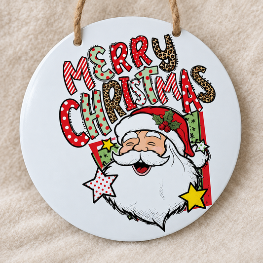 Close-up detail of the MERRY CHRISTMAS patterned lettering and Santa face