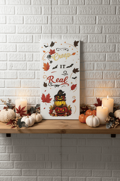 Creep It Real Halloween canvas sign decor featuring bats, pumpkins, and autumn leaves on a wooden shelf with candles.