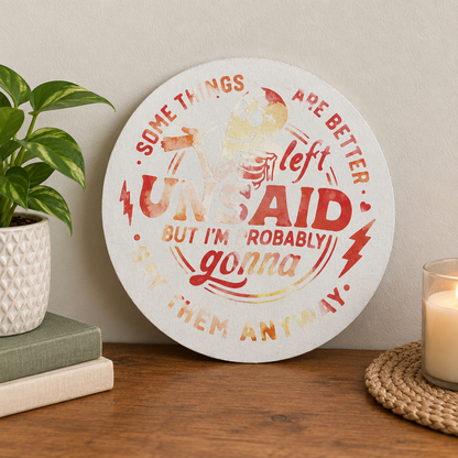 Handmade funny round sign leaning against a neutral wall