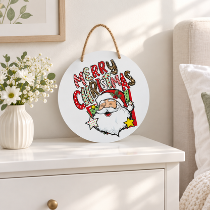 Merry Christmas round metal sign on a white dresser with a vase of flowers