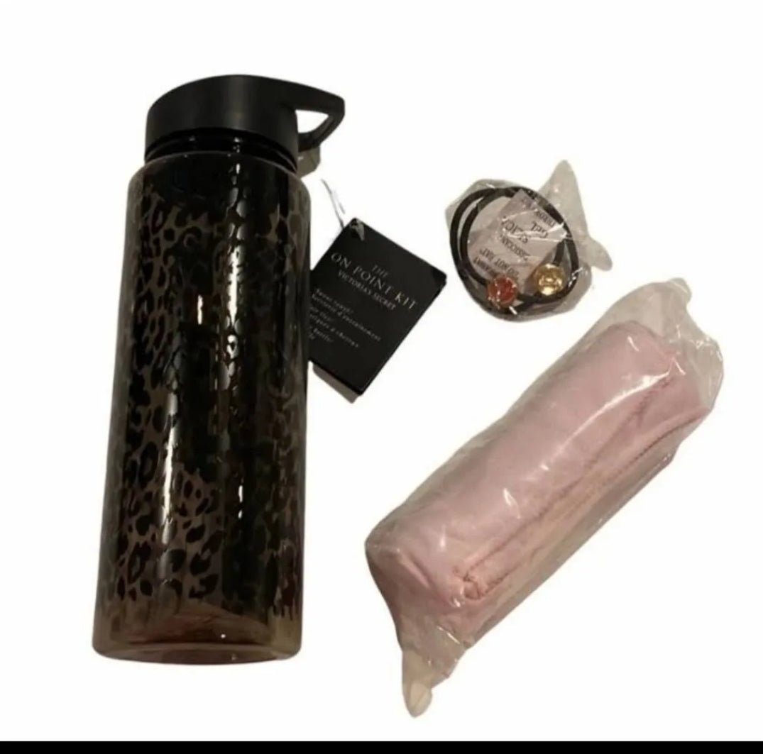 Victoria's Secret workout kit featuring a leopard print water bottle, hair ties, and a sweat towel.