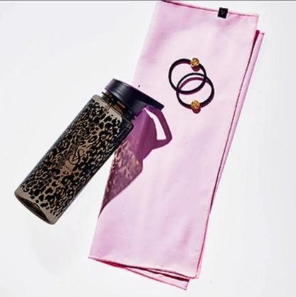 Victoria's Secret workout kit: sweat towel, hair ties, and water bottle displayed together.