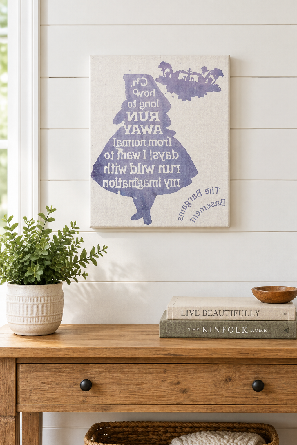 Run Wild with My Imagination canvas sign hanging on a white shiplap wall above a console table