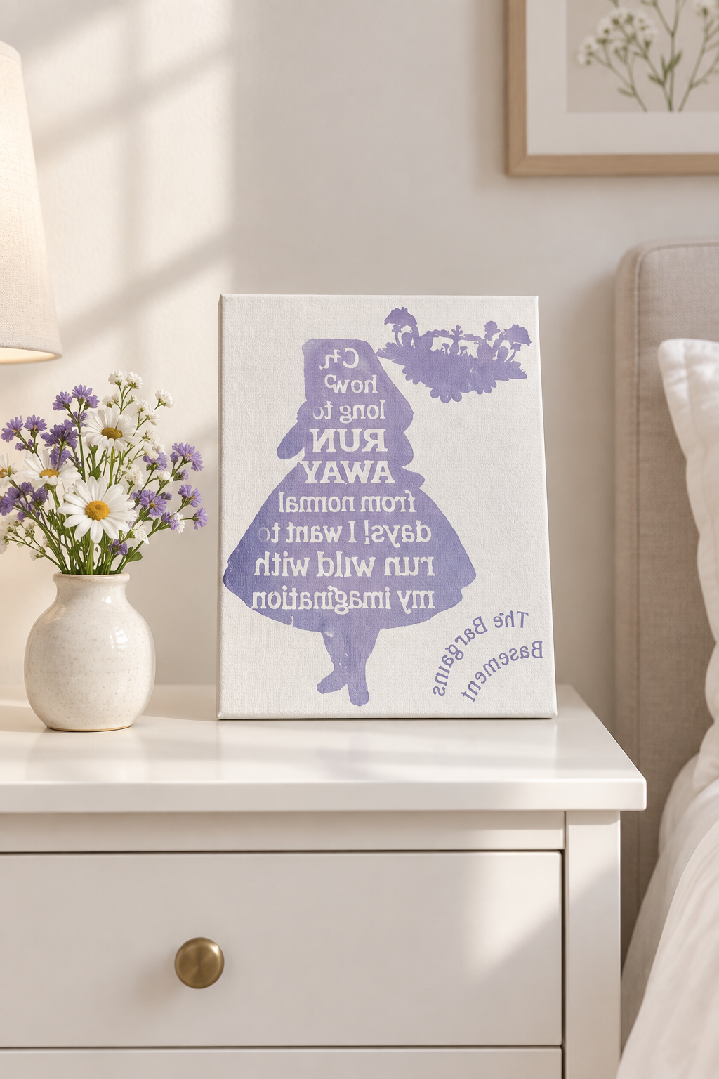Run Wild with My Imagination canvas sign on a white dresser with a vase of flowers