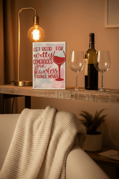 Sip Happens handmade witty comebacks canvas sign displayed on a shelf next to wine glasses and a bottle.