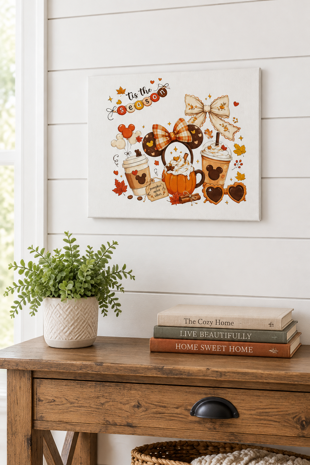 Tis the Season canvas sign hanging on a white shiplap wall above a console table