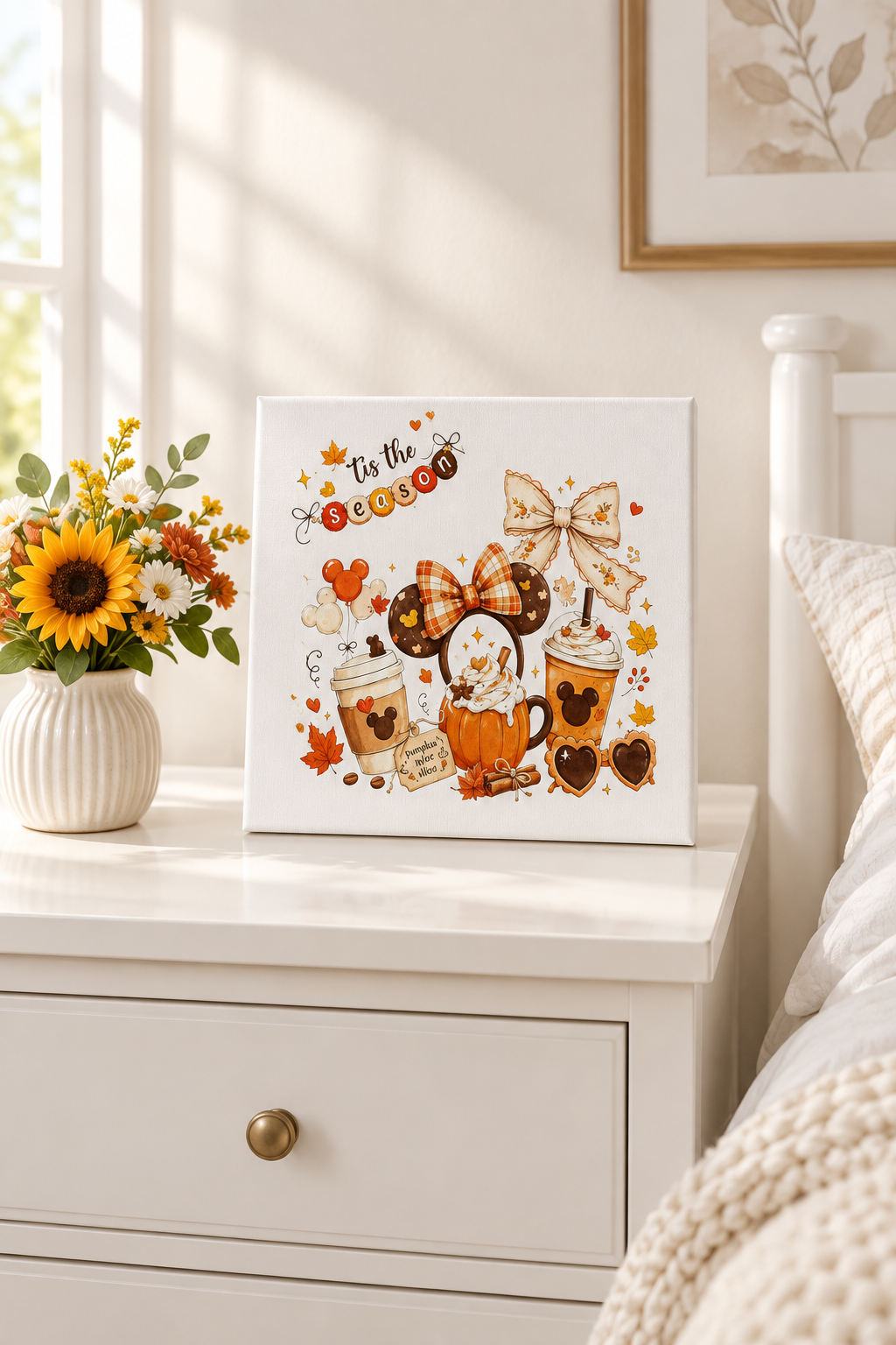 Tis the Season canvas sign on a white dresser with a vase of flowers