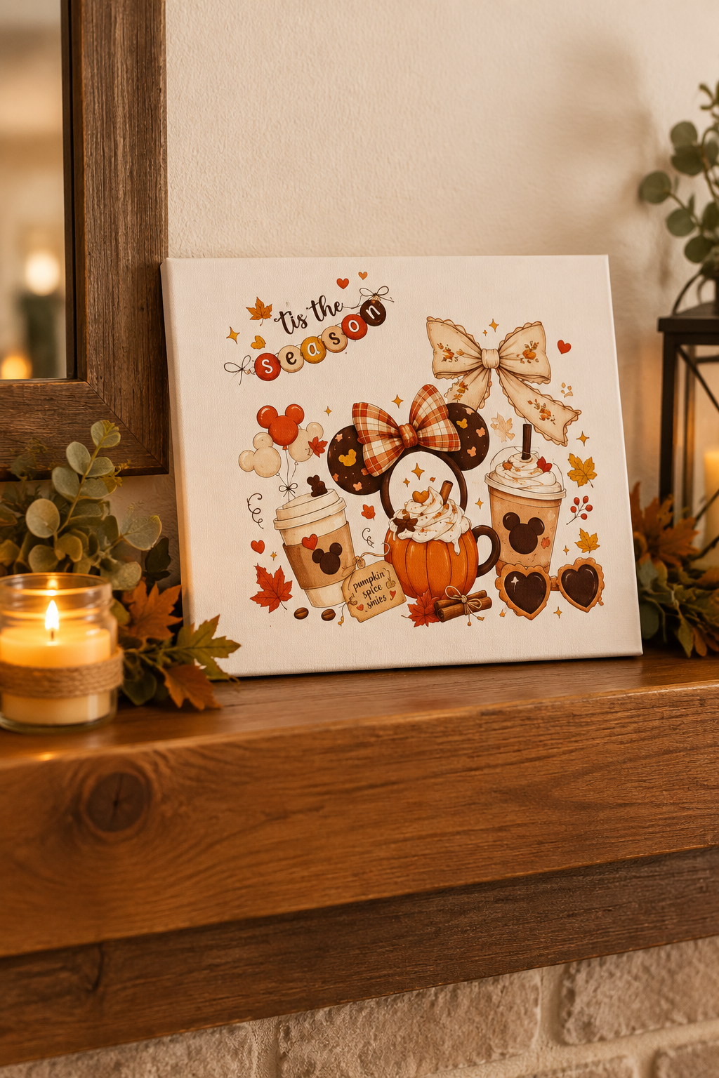 Tis the Season canvas sign on a wooden mantel with a candle and greenery
