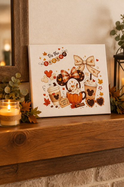 Tis the Season canvas sign on a wooden mantel with a candle and greenery