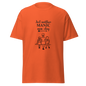 Orange unisex classic tee with 'Just another MANIC mom-day' graphic, perfect for casual streetwear. 100% cotton and breathable.
