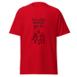 Red unisex classic tee with 'Just another MANIC mom-day' design, made of breathable cotton poly blend.